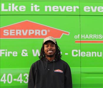 male employee wearing a SERVPRO® hat and jacket